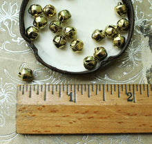 Load image into Gallery viewer, Tiny Bright Gold Bells - 6mm Primitive Christmas Jingle Bells - Dollhouse Holiday Trim Miniatures 1/4 Inch Bell Trim for Decorating